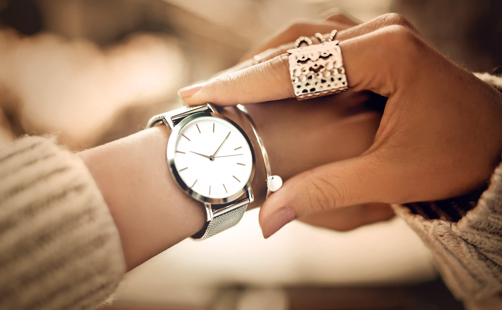 Image showcasing woman wearing watch