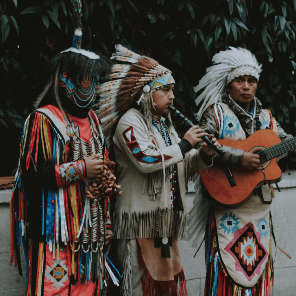 Image of Native Americans wearing war bonnets