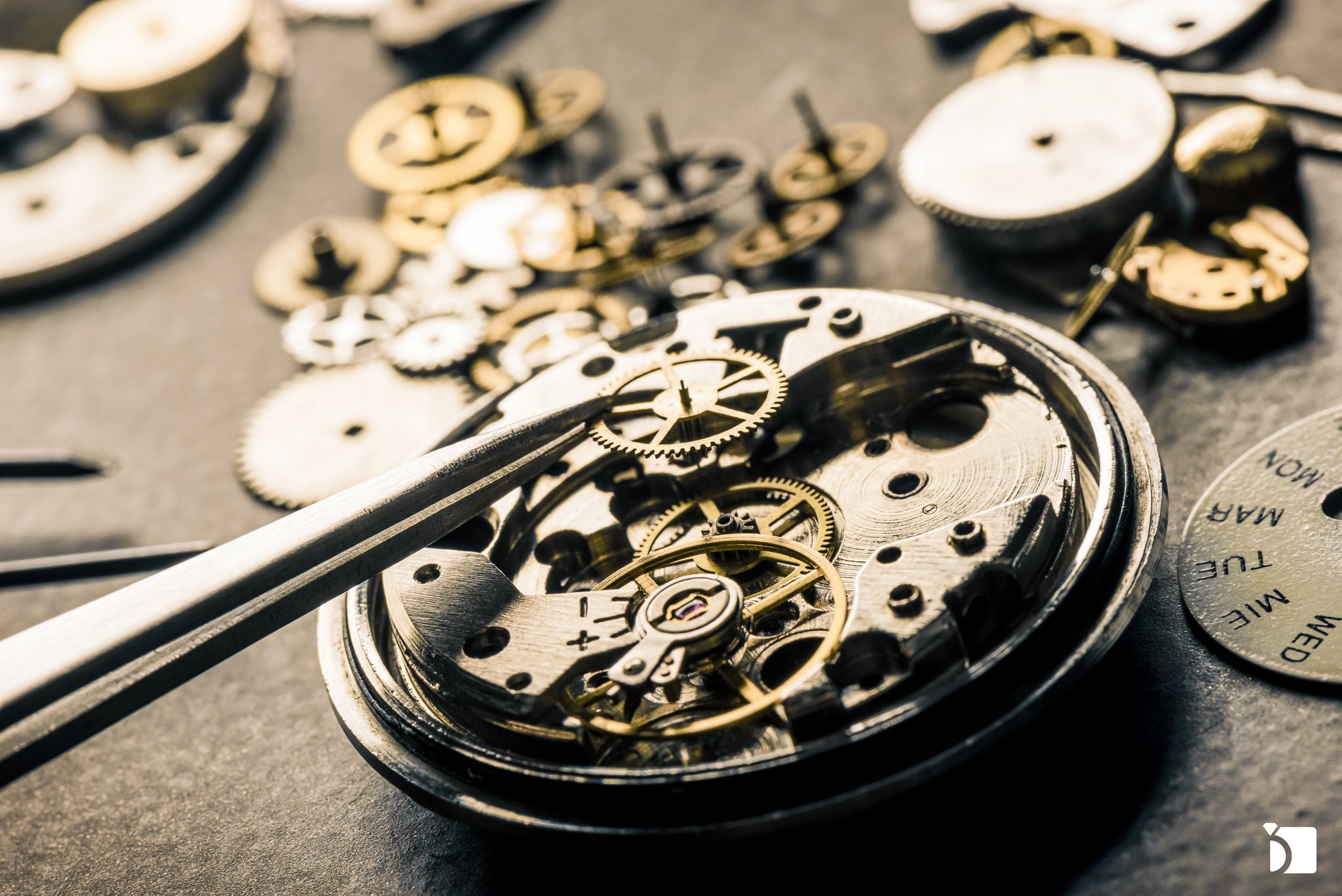 Open faced watch getting repaired, watch movement repair service