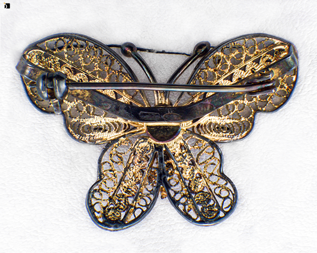 Image Showcasing Before #12 Back View of a Tarnished Butterfly Brooch Getting Extreme Restoration Services by Master Jewelers