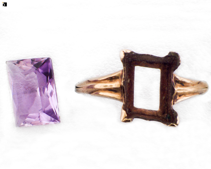 Image Showcasing Before #2 Top View of a Gold Ring with Purple Gemstone Getting Extreme Transformation Through Premier Ring Repair Services and Gemstone Resetting by My Jewelry Repair Master Jewelers