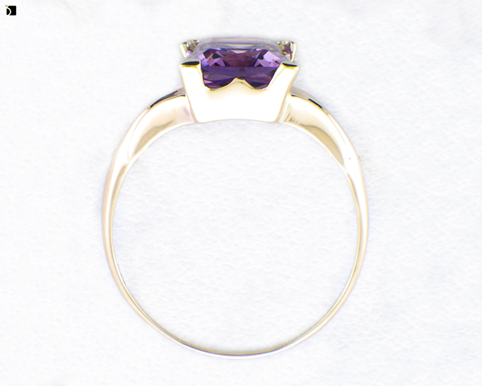 Image Showcasing After #2 Flat View of a Gold Ring with Purple Gemstone Getting Extreme Transformation Through Premier Ring Repair Services and Gemstone Resetting by My Jewelry Repair Master Jewelers