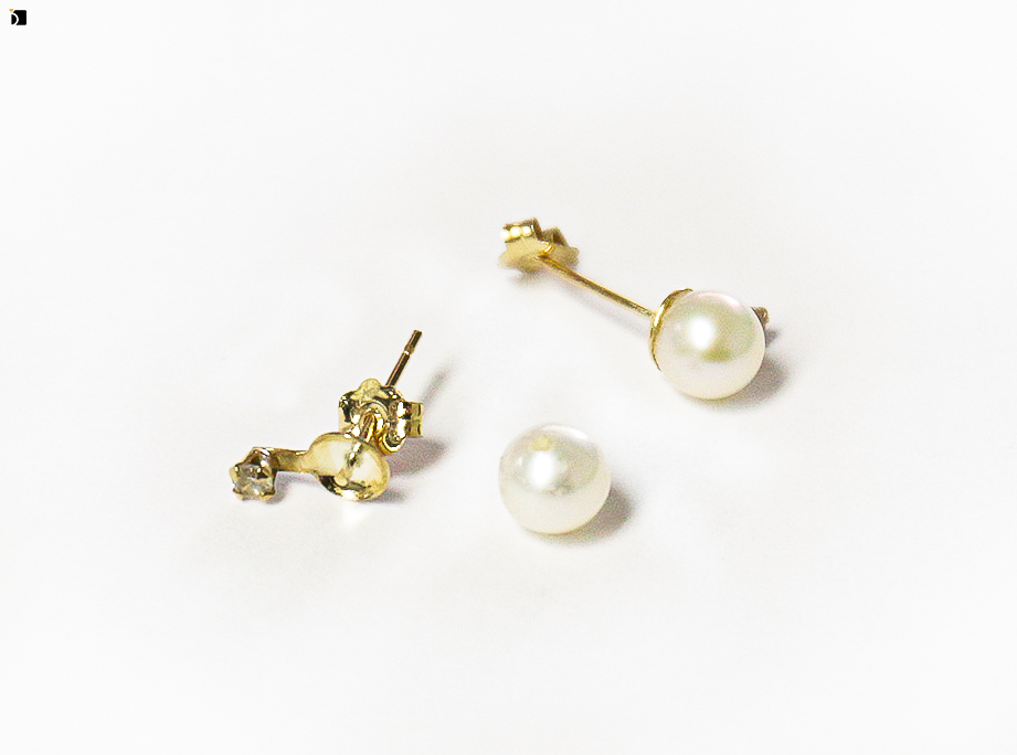 Image showcasing the Before #98 of a Pearl Earrings Set Being Restored Through Pearl Gemstone Resetting and Premier Earring Services