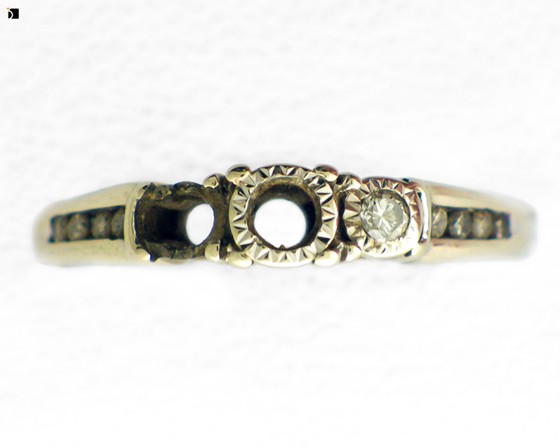 Before #116 Top View of a White Gold Engagement Ring Needing Gemstone Replacement Services