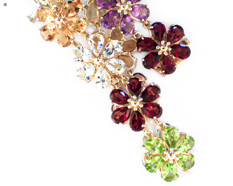 After #136 Multi-Colored Gemstone Flower Bracelet Restored with New Garnet and White Topaz Gemstones on White Background