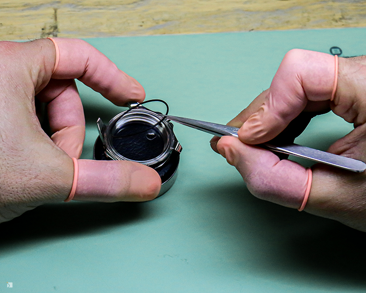 Certified Watchmaker Breaking Down Watch Movement For Timepiece Servicing