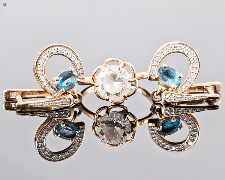 Restored Aquamarine and Diamond Gemstone Jewelry Reflected on Display