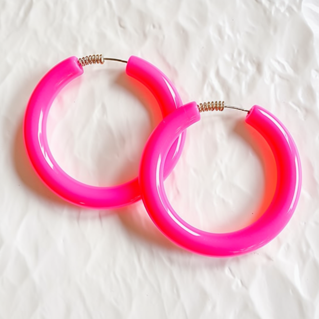 photo of pair of vibrant pink hoop earrings