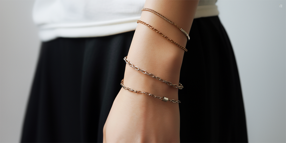 Permanent and Non-Permanent Fine Jewelry Bracelet Stack on a Person's Wrist Casual Outfit