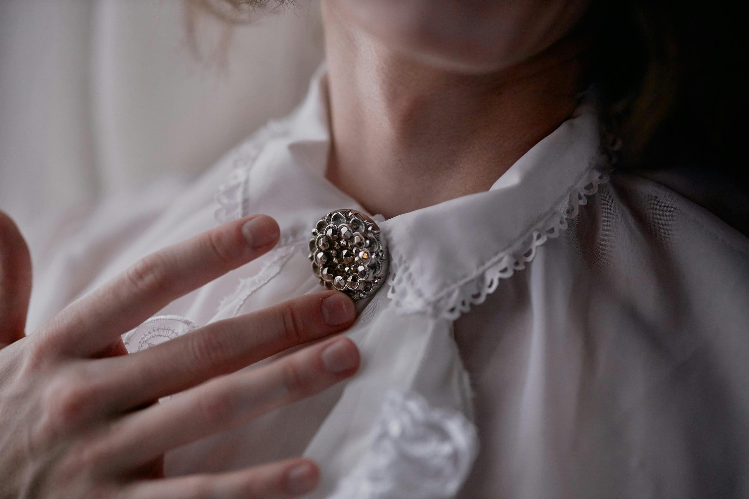 Image showing women's brooch on white clothing