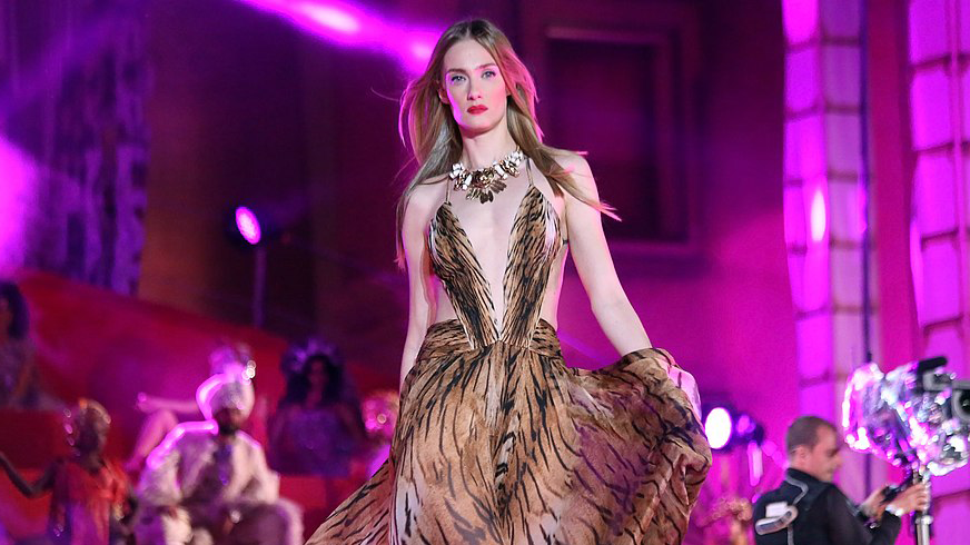 Image showing model wearing Versace jewelry and dress on runway